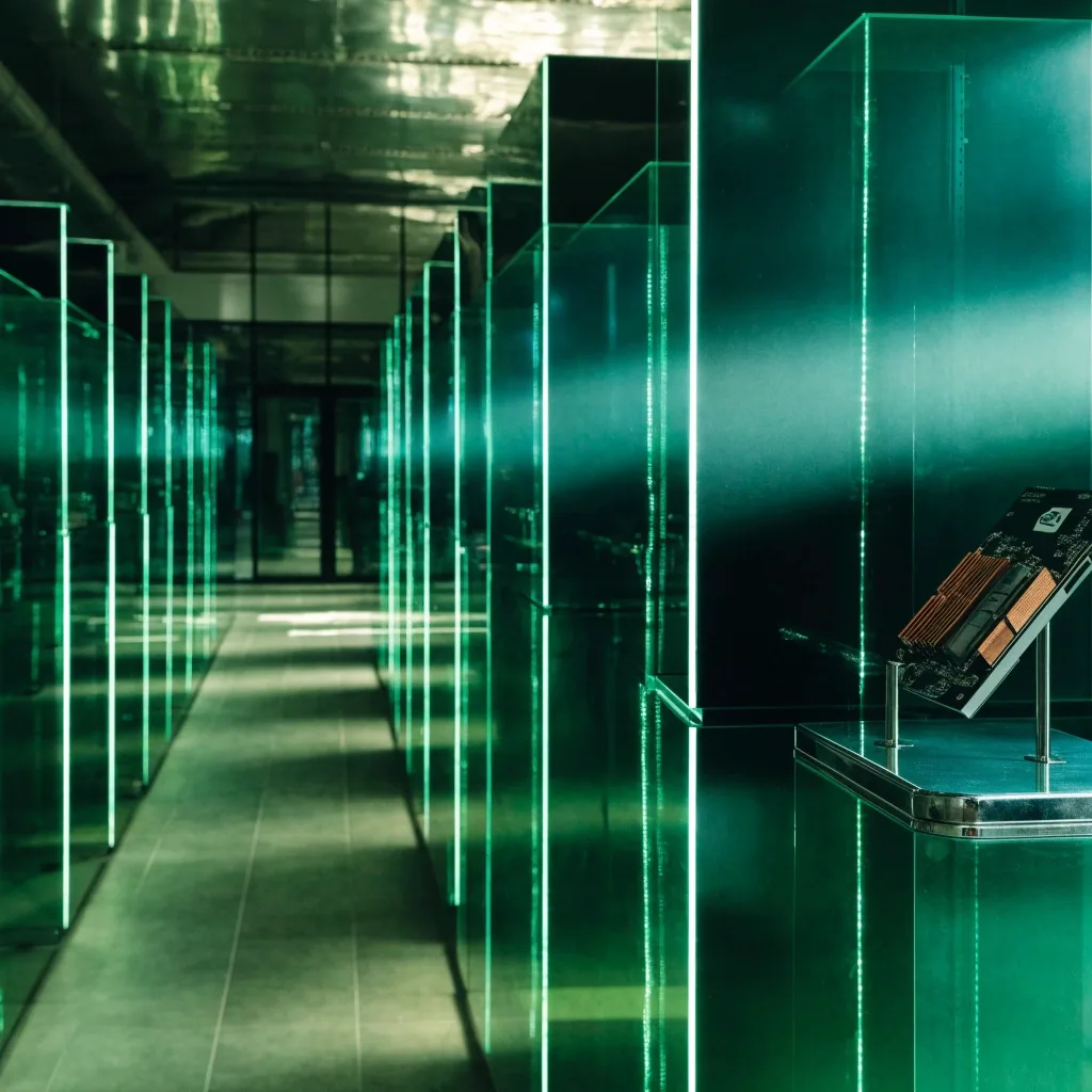 Distance view of a lit emerald shelf interior receding down a mall hall